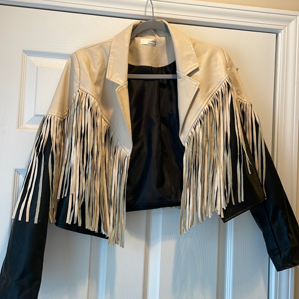 Cropped fringe faux leather jacket.